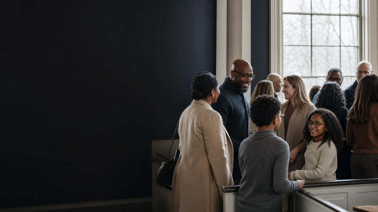 Illustrative photograph of a diverse congregation gathering for worship in a contemporary church.
